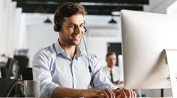 Photo of businesslike man 20s wearing office clothes and headset